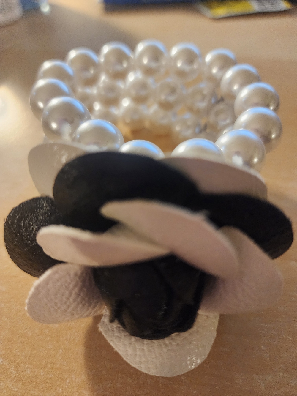 Pearl Stretch Bracelet with Black & White Leather Flower Accent